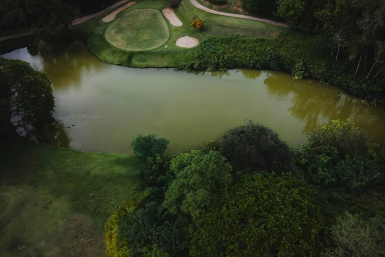 Golf course hole with a pond